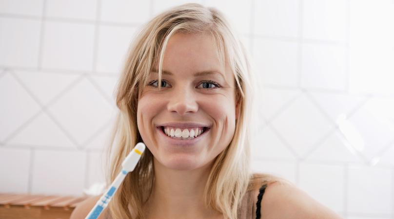 Closeup on woman with toothbrush