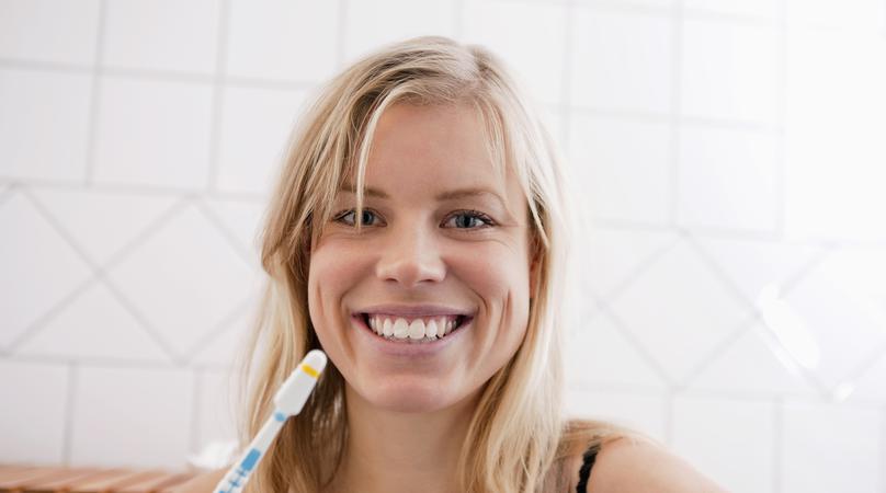Closeup on woman with toothbrush